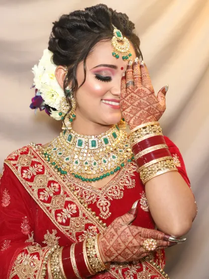 A candid, happy moment showing off a shimmery, champagne-toned eyeshadow look that brightens the entire face.
