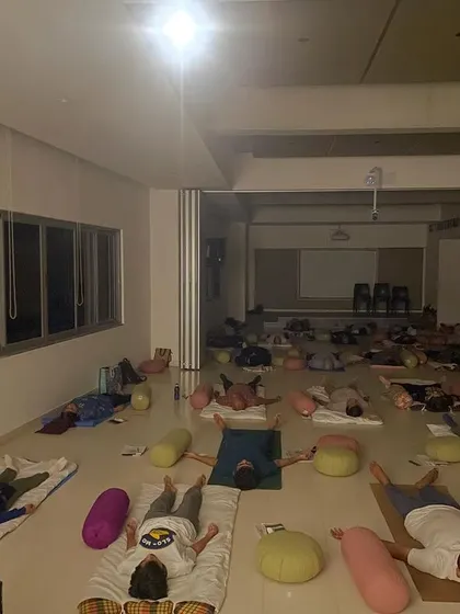 The culmination of a calm mind experience I led for the Unboxing Bangalore Habba. Participants are in deep relaxation, finding a moment of collective mindfulness and quiet in a large, open space.