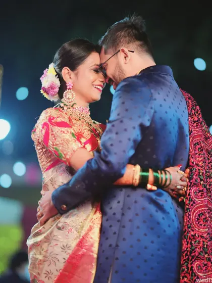 An intimate photo of a couple embracing on the dance floor, capturing the romance and joy of their wedding reception.