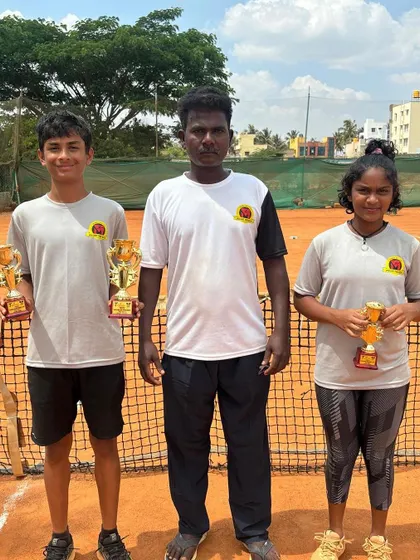 Our coach with our two champions, Svar and Eshita, after their successful run at the Tennis Arena in Bangalore.