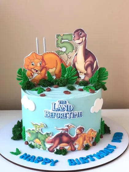 A nostalgic 'The Land Before Time' cake, perfect for a dinosaur-loving kid's birthday party.