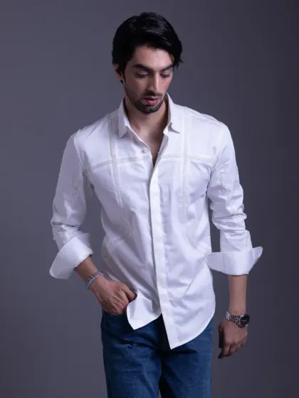 Not just a shirt, it's a masterpiece. This white shirt with subtle horizontal detailing is a versatile staple for any man's wardrobe, easily dressed up or down.