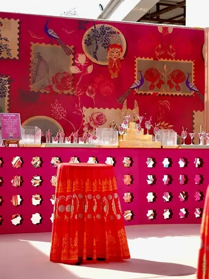 Even the bar was designed to match the theme. The bar counter features a vibrant pink jali-work front and a custom-printed backdrop, ensuring every corner of the event is picture-perfect.