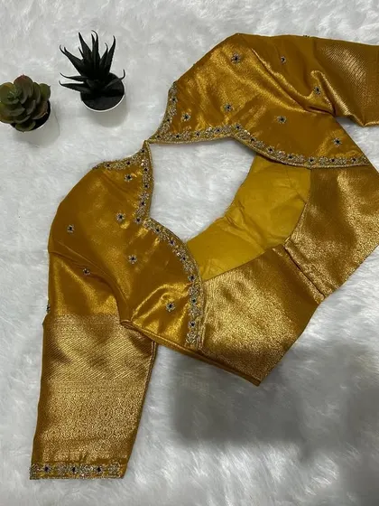 A golden hour in fabric form. Mustard tones, intricate threads, and a silhouette that whispers sophistication.