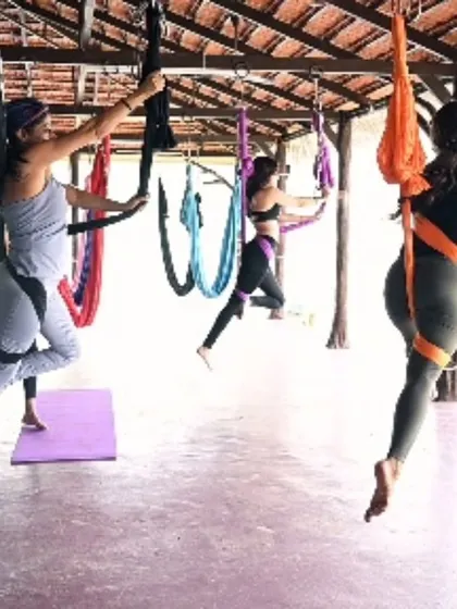 More happy faces from our retreat's aerial yoga class. The colorful hammocks create such a vibrant and playful atmosphere for everyone to explore.