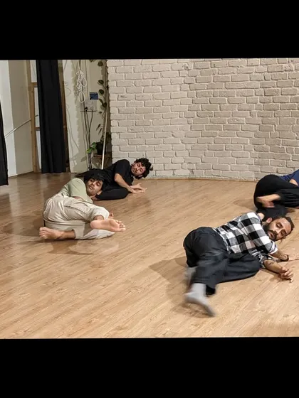 A moment of rest and recovery on the floor after a strenuous but rewarding strength and conditioning session.