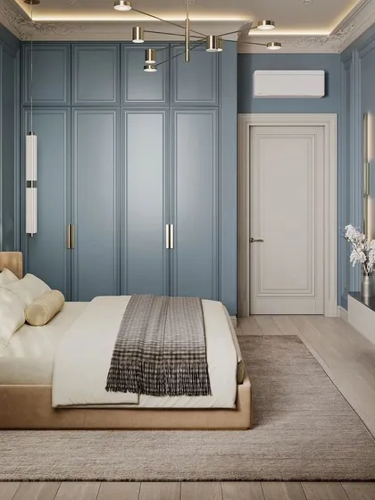 Another angle of the blue bedroom, showing the wardrobe and the entrance door.