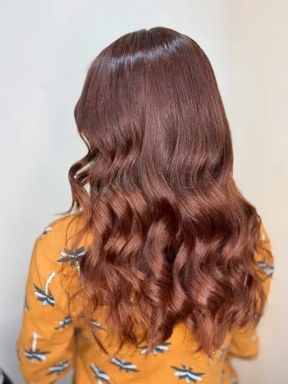 The side profile of this chocolate brown style shows off the soft layers and beautiful shine.