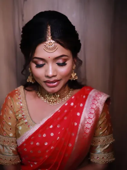 Beautiful Rachana, ready for her pre-wedding function. Her makeup is soft and elegant, with a focus on glowing skin and a pretty lip color.