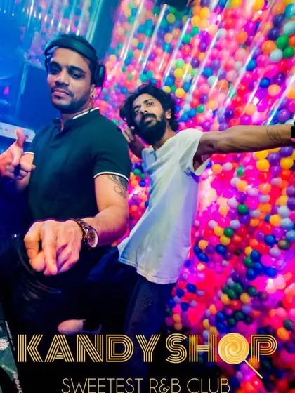 DJing during a 'Uni Edition' night at Kandy Shop. The colorful ball pit wall makes for a unique backdrop while I spin a mix of Bollywood and R&B for the student crowd.