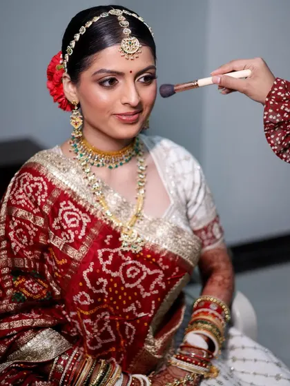 A candid shot of me applying the finishing touches to Siya's makeup. You can see the soft, diffused eyeshadow and the natural, skin like finish of the base.