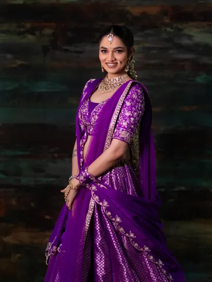 A happy, smiling shot of the model. This look proves that modern brides can embrace bold and unconventional colours.