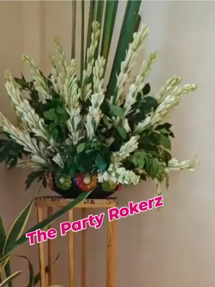 A simple yet elegant floral arrangement of white tuberoses (rajnigandha) used as part of the overall Teej decor.