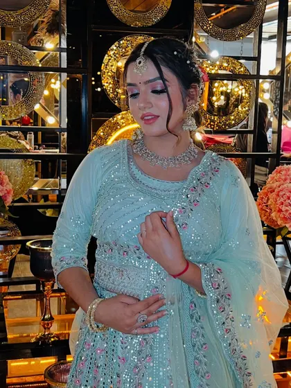 A close-up of the makeup for the light blue outfit. The shimmery pink eyeshadow and winged liner make the eyes pop, while the rest of the makeup is kept fresh and dewy.