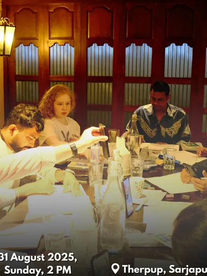A candid shot of participants deeply engaged in the painting process during our workshop. The cozy indoor setting is perfect for a relaxed art session.