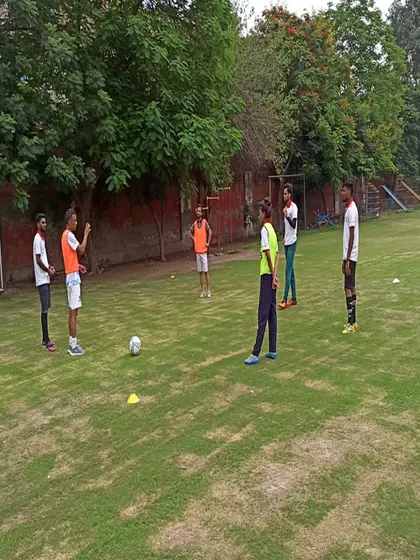 A practical session during a YDFA coaches workshop. Our coaching staff actively participates in drills to better understand the techniques they teach our players.