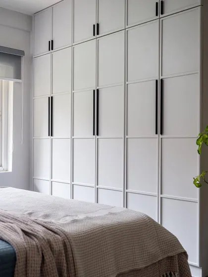 A duplicate of image 40, showcasing the minimalist, geometric wardrobe design.