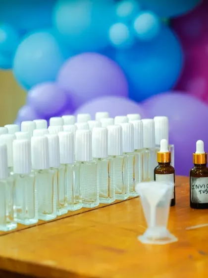 A perfume-making station where guests can mix their own scents, offering a unique and sophisticated party activity.