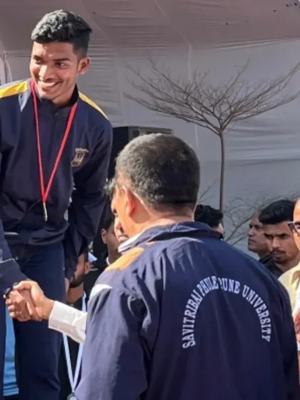 A handshake of respect and victory. My athlete Gagan Amin receiving his medal at the state inter-university championship.