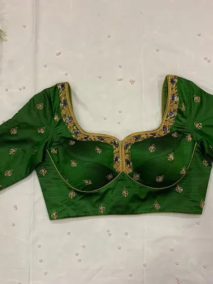 The same green blouse with a padded bust design, perfect for providing shape and support.
