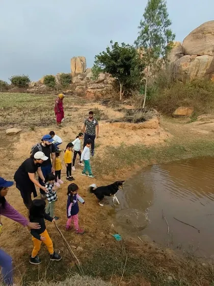 Even the doggo enjoys a splash in a puddle during our community trek, reminding us of the simple joys of being outdoors.