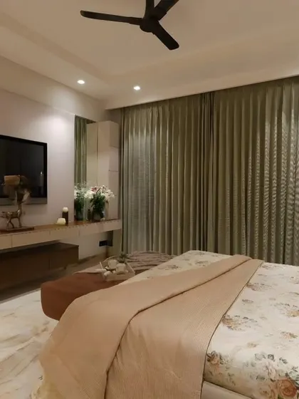 Another perspective of the TV wall, emphasizing the clean lines and clutter-free design that contributes to the room's serene ambiance.