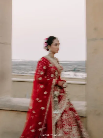 An artistic motion-blur shot of the bride, conveying a sense of movement and dreaminess.