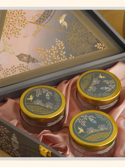 A different angle of the "Grey Delight" hamper, showing the three jars nestled in pink satin.