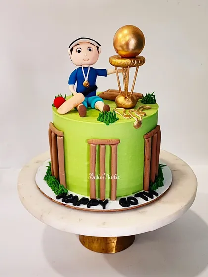 A full view of the cricket-themed 60th birthday cake, an eggless Chocolate-Orange flavor.