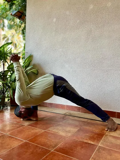 This series shows the preparatory poses for Yoga Dandasana, including variations of Ardha Matsyendrasana, Eka Pada Rajakapotasana, and Baddha Virabhadrasana. It highlights the importance of preparing the body with twists and hip openers.