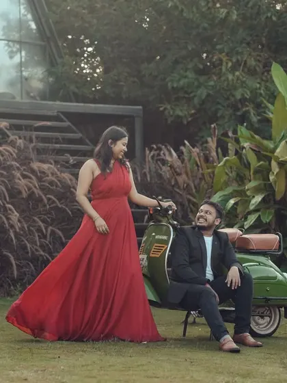 I create fun, vibrant memories with props like our vintage scooter. This couple's pre-wedding shoot in our lush garden set shows how we can match your outfits and personality to the perfect backdrop.