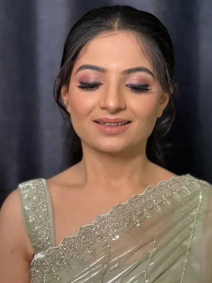 A shot with eyes closed, highlighting the soft and delicate eyeshadow work.
