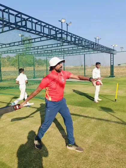 Our coaches lead by example. Here, a coach demonstrates the correct throwing technique during a fielding session, ensuring players understand the biomechanics of a powerful and accurate throw.