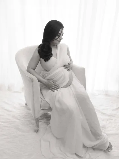 Another angle of the modern white saree look, showing the graceful lines and soft fabric. The focus is on creating a portrait that is both elegant and uniquely styled.