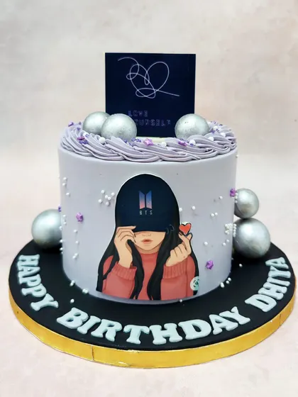 We celebrate the global phenomenon with this stylish BTS Army cake. Featuring fanart and the "Love Yourself" album logo on a chic lavender cake with silver accents, this design is a perfect tribute for any devoted fan's birthday.