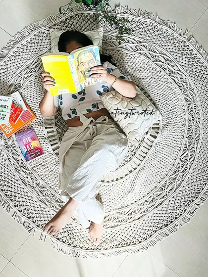 This is what my perfect Sunday looks like. Curled up on one of my handmade macramé rugs, lost in a good book. I designed this piece to be incredibly soft and thick, making it the perfect spot for creating your own cozy corner at home.