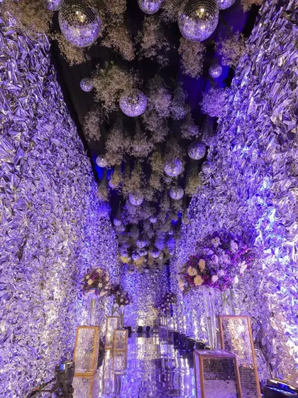 A shot of the stunning decor, featuring a ceiling of disco balls and flowers, showing my attention to detail.
