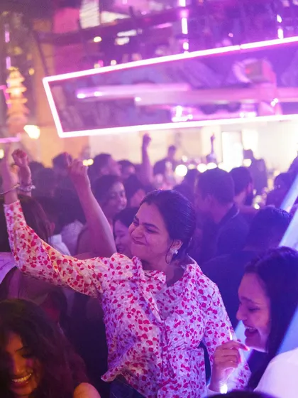 The joy on the dance floor is contagious. A snapshot of a partygoer lost in the music, which is the ultimate reward for any DJ.
