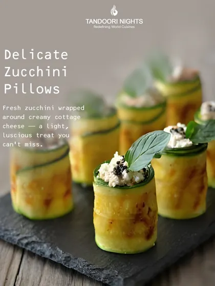 Our Delicate Zucchini Pillows are a light and luscious treat. Fresh zucchini is wrapped around creamy cottage cheese, offering a refreshing and elegant appetizer option.