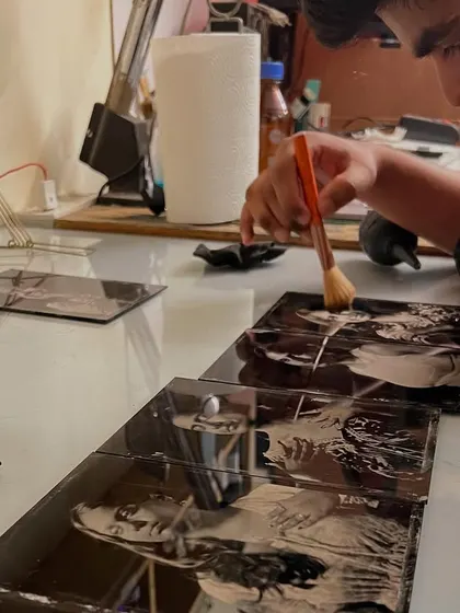 After the plate is developed, it needs to be varnished to protect the delicate silver image. I apply the varnish by hand with a soft brush, which is the final step in preserving your portrait for generations.