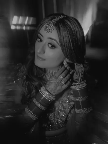 The same portrait in black and white, giving it a timeless, classic, and dramatic quality.