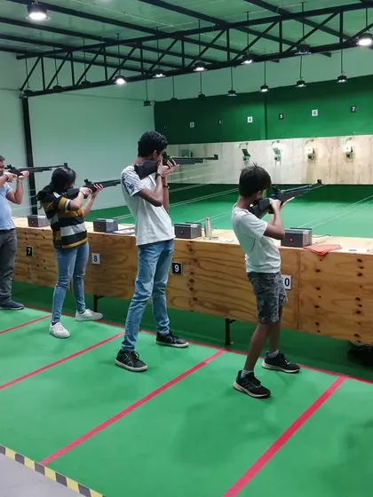 A group of new shooters learning the ropes side-by-side. My range setup allows for multiple people to shoot at once, making it a great group activity.