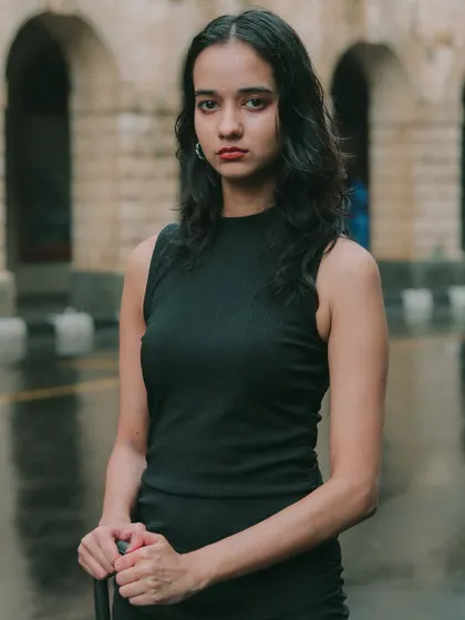 A close-up portrait in the rain, capturing a raw and direct gaze. These are the moments of quiet intensity I love to find in a solo shoot.