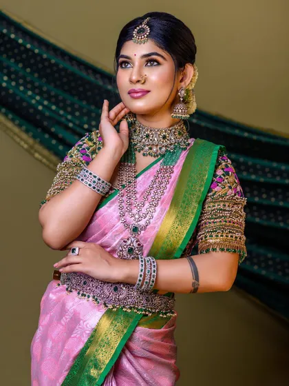 A semi-traditional look created for a professional makeup course. The model is wearing a Victorian-style set with green stones, which offers a modern twist to the bridal look.