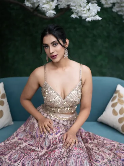 I love adding a subtle pop of color to a look. Here, the berry-toned lip color picks up the hues in the gorgeous lehenga, tying the whole look together.