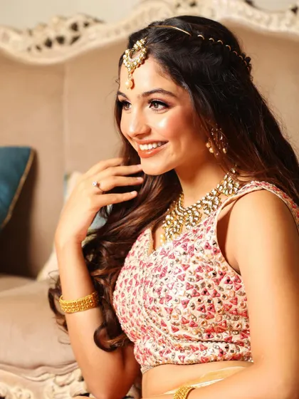 Saamya's joyful smile is the best part of this look. The makeup is designed to feel light and let her personality shine.
