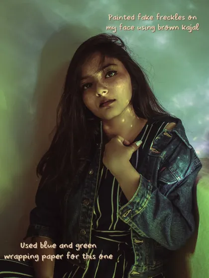I used blue and green wrapping paper to cast colorful light for this self-portrait and even painted on fake freckles with brown kajal. Experimenting is a huge part of my creative process.