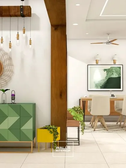 Another view of the eclectic living space, highlighting the contrast between the green console, yellow planter, and the warm wooden pillar that frames the view into the dining area.