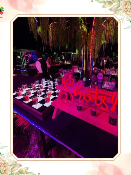 Our afterparty shots bar, featuring a creative chessboard setup and neon lights to keep the energy high.