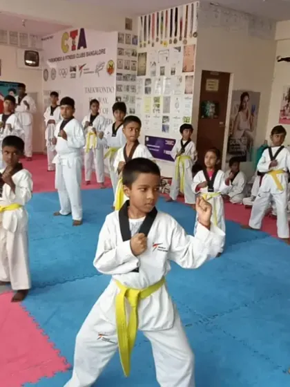 I lead the class, demonstrating the correct form for a middle block.